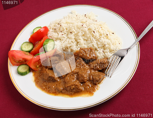 Image of beef korma, basmati and salad meal