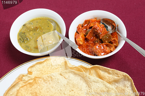 Image of Poppadoms with lime and mango pickles