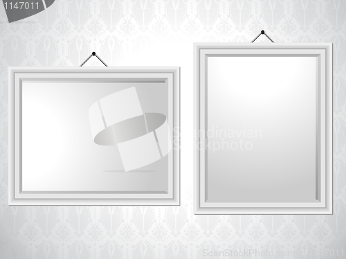 Image of White Picture Frames on Wallpaper Background