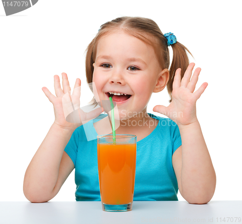 Image of Little girl with orange juice