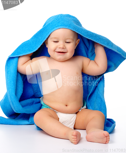 Image of Cute child wrapped in blue towel
