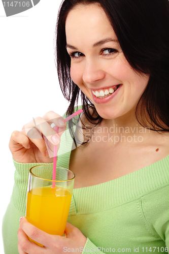 Image of Young attractive woman drinks orange juice
