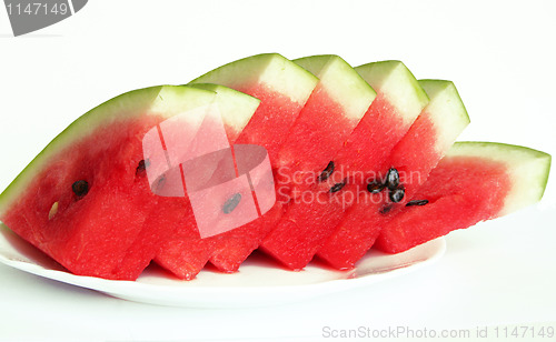 Image of Slices of juicy watermelon served on white plate