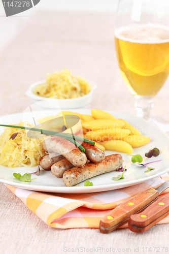 Image of White sausage with sour cabbage