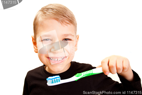 Image of The boy brushes teeth