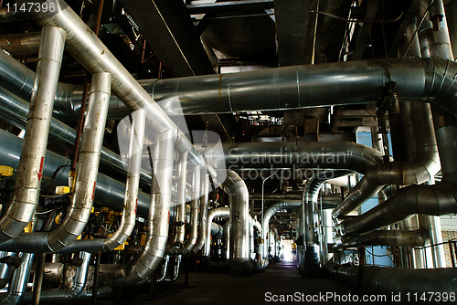 Image of Equipment, cables and piping as found inside of a modern industr