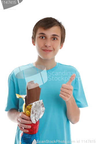 Image of Boy eating chocolate rabbit