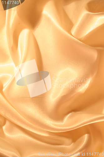 Image of Smooth elegant golden satin as background 