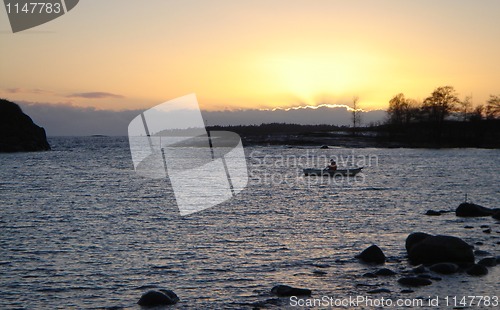 Image of Gold Sea Sunset with Boat in Finland