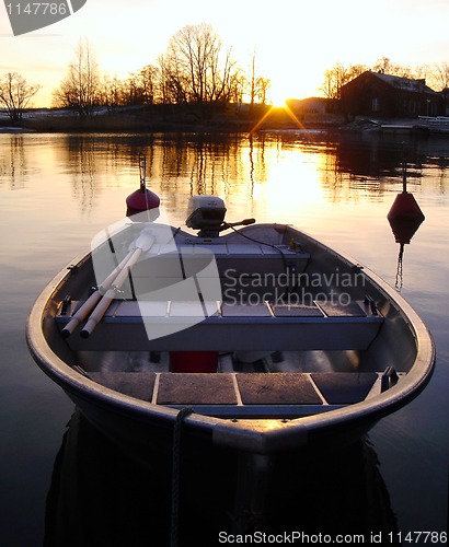 Image of Golden Boat on Sunset in Finland