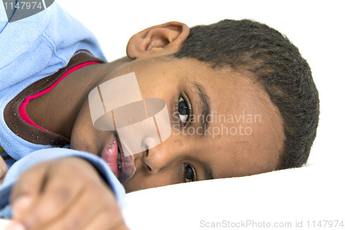 Image of Boy resting in his bed