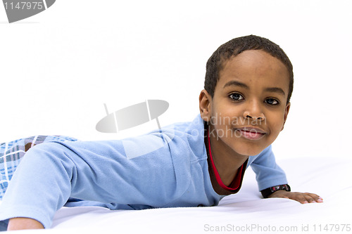 Image of Portrait of a young boy raising his head
