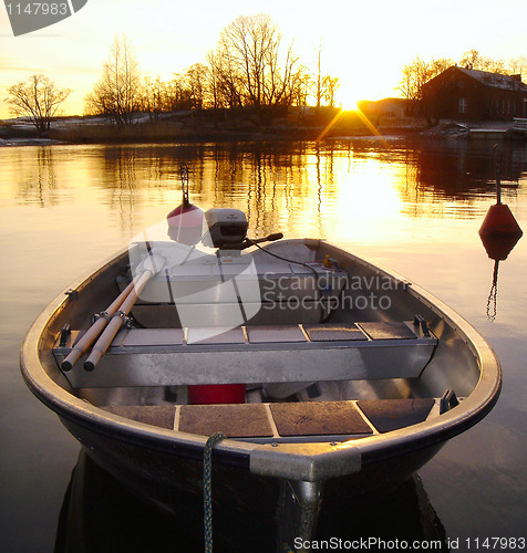 Image of Golden Boat on Sunset in Finland