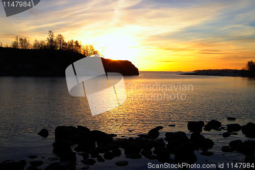 Image of Golden winter sea sunset in Finland