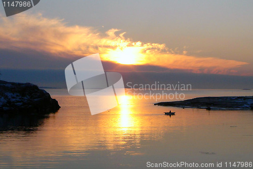 Image of Gold Sea Sunset with Fishing Boat in Finland