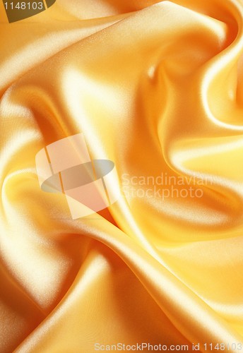 Image of Smooth elegant golden satin as background 