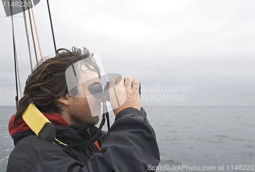 Image of Sailor looking in binoculars