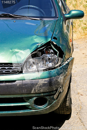 Image of Green car wreck