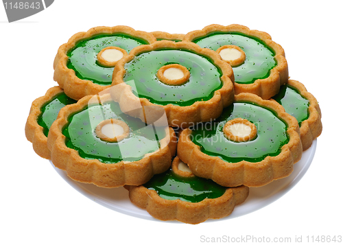Image of Cookies with green jelly on white plate, isolated