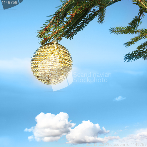 Image of golden bauble on tree