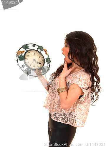 Image of Pretty Asian girl with clock.