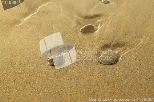 Image of Pebbles on sand