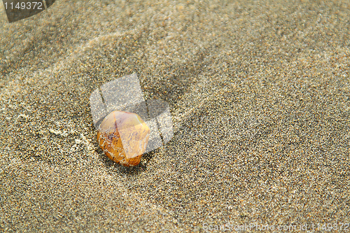 Image of Stone on sand