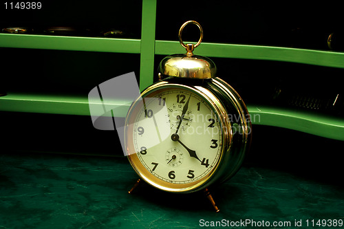 Image of Old gold alarm clock