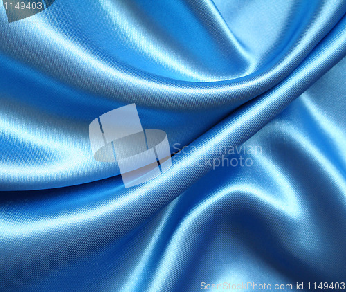 Image of Smooth elegant blue silk as background 