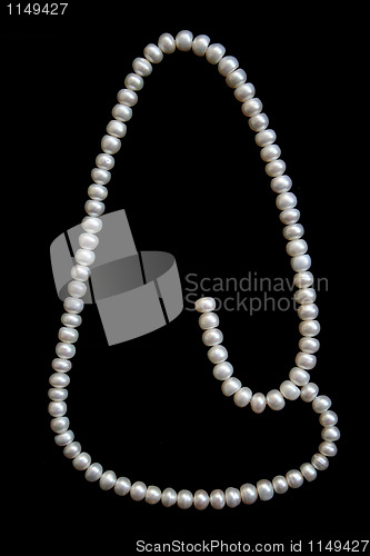 Image of White pearls on the black velvet 