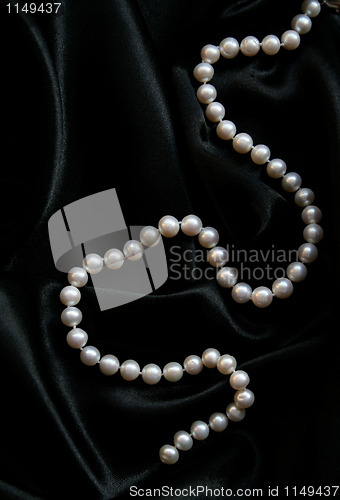 Image of White pearls on the black velvet 