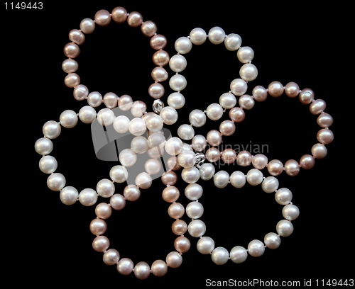 Image of Flower of white and pink pearls on a black silk 