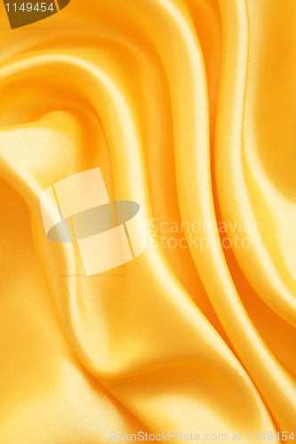 Image of Smooth elegant golden satin as background 
