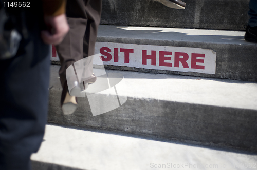 Image of Sit here