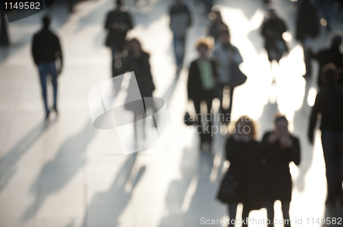 Image of Crowd in of shoppers in evening light