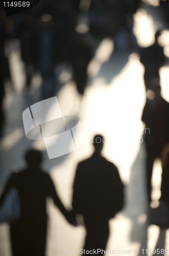 Image of Crowd in sunlight with couple