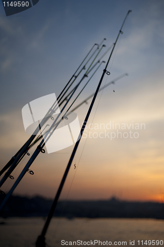 Image of Fishing rods in sunset