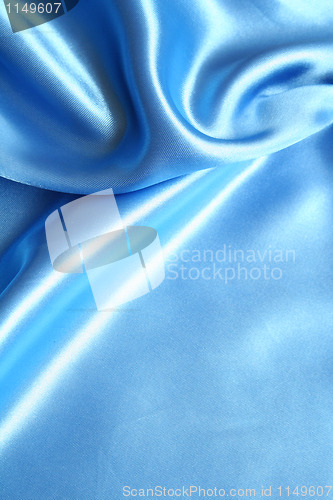 Image of Smooth elegant blue silk as background 