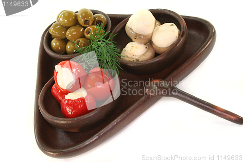 Image of olives, stuffed peppers and mushrooms