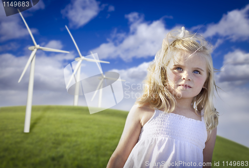 Image of Beautiful Young Girl and Wind Turbine Field