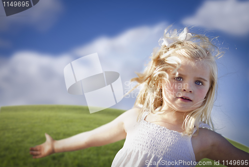 Image of Adorable Blue Eyed Girl Playing Outside