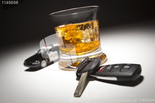 Image of Highway Patrol Police Car Next to Alcoholic Drink and Keys