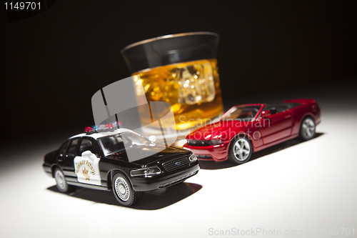 Image of Police and Sports Car Next to Alcoholic Drink