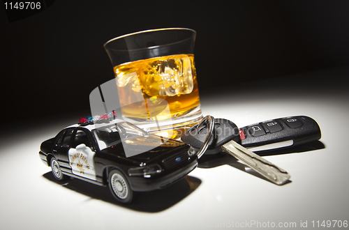 Image of Highway Patrol Police Car Next to Alcoholic Drink and Keys