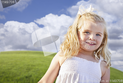 Image of Adorable Blue Eyed Girl Playing Outside