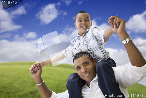 Image of Hispanic Father and Son Having Fun Together