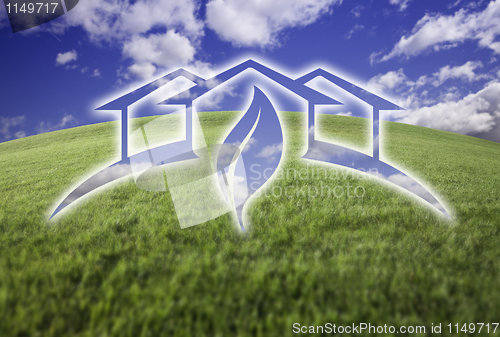 Image of Ghosted Green House Over Fresh Grass and Sky