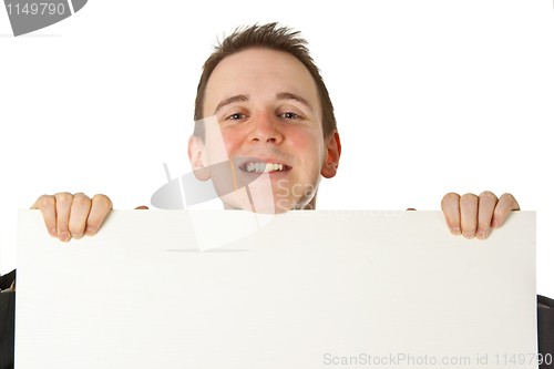 Image of Young businessman with white board