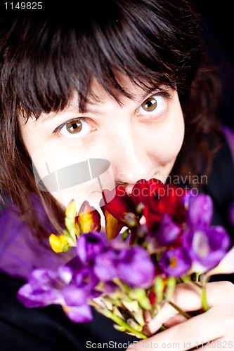 Image of woman with purple flower