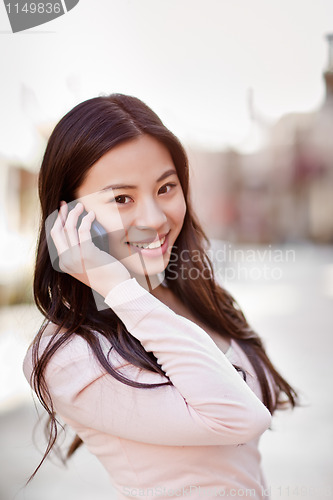 Image of Asian woman on the phone